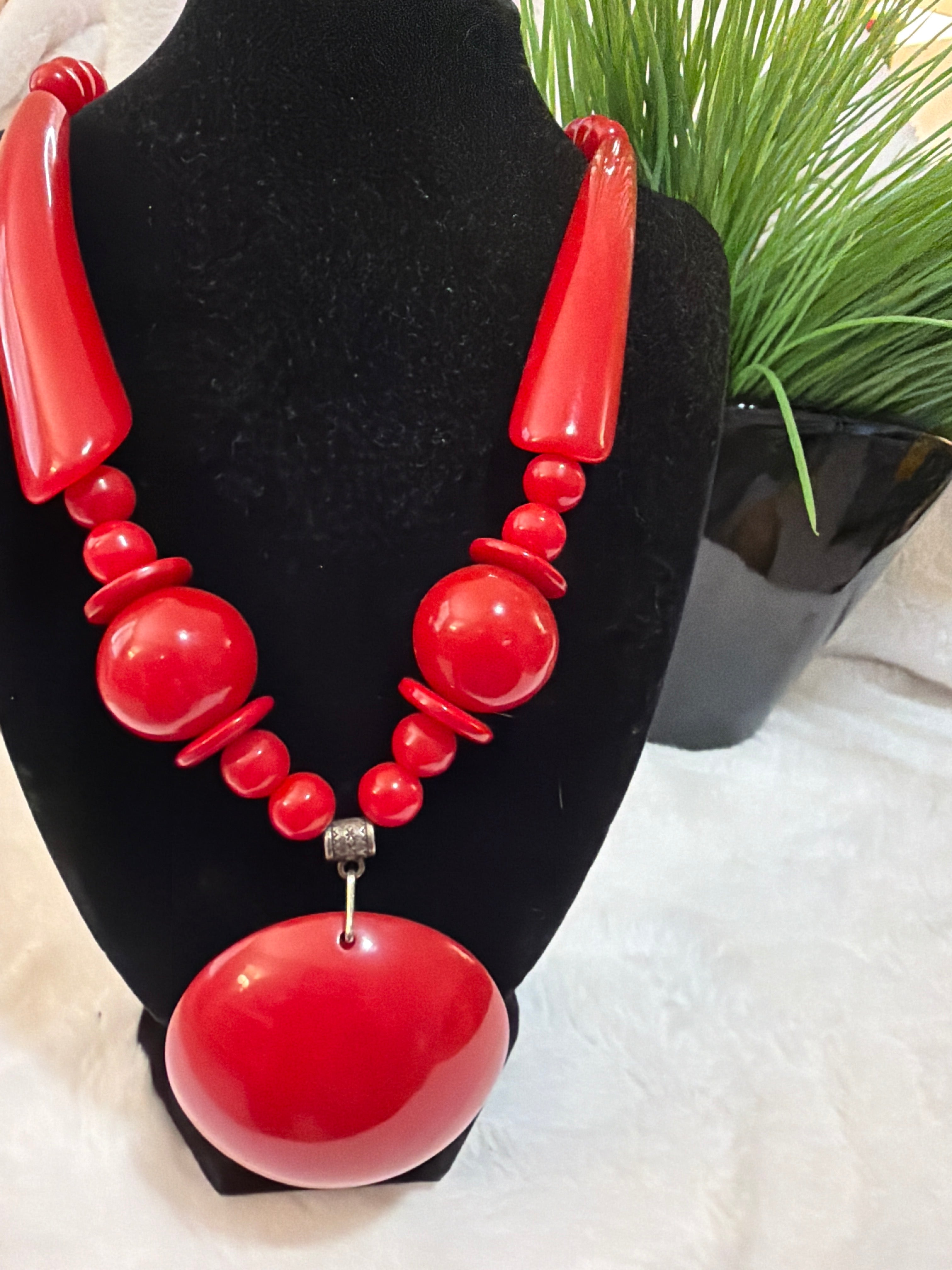 Red, heavy plastic necklace, $10.00